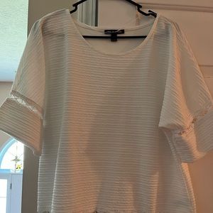 Cute white top that has never been worn, it has been washed though.